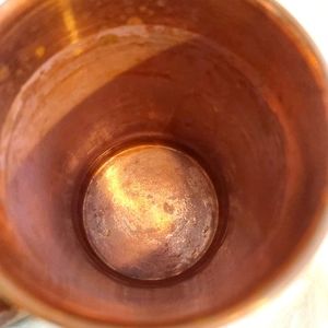 Set of two copper cups with lids